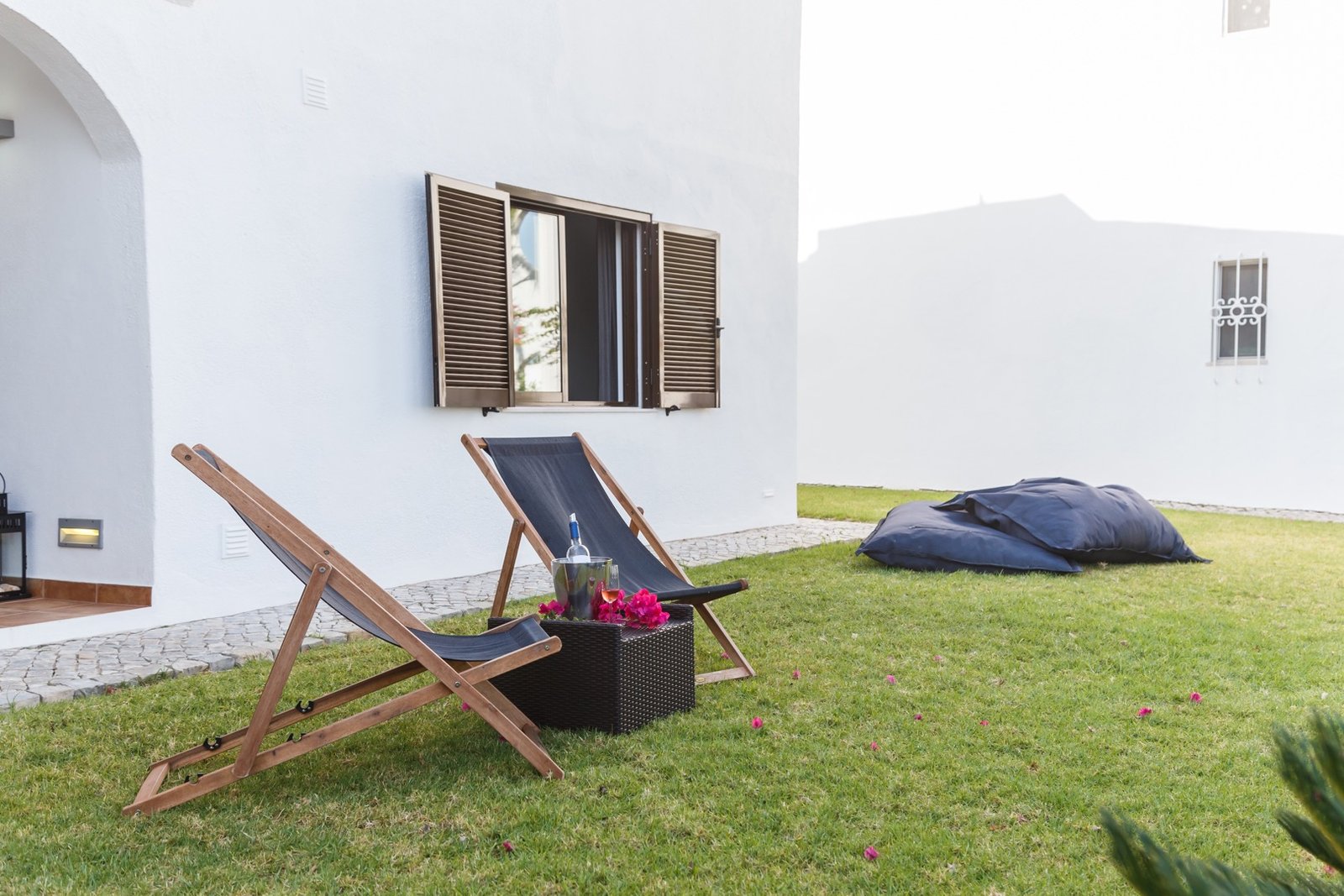 summer apartment garden with chairs and pillows setup Comfortable Villa in Green